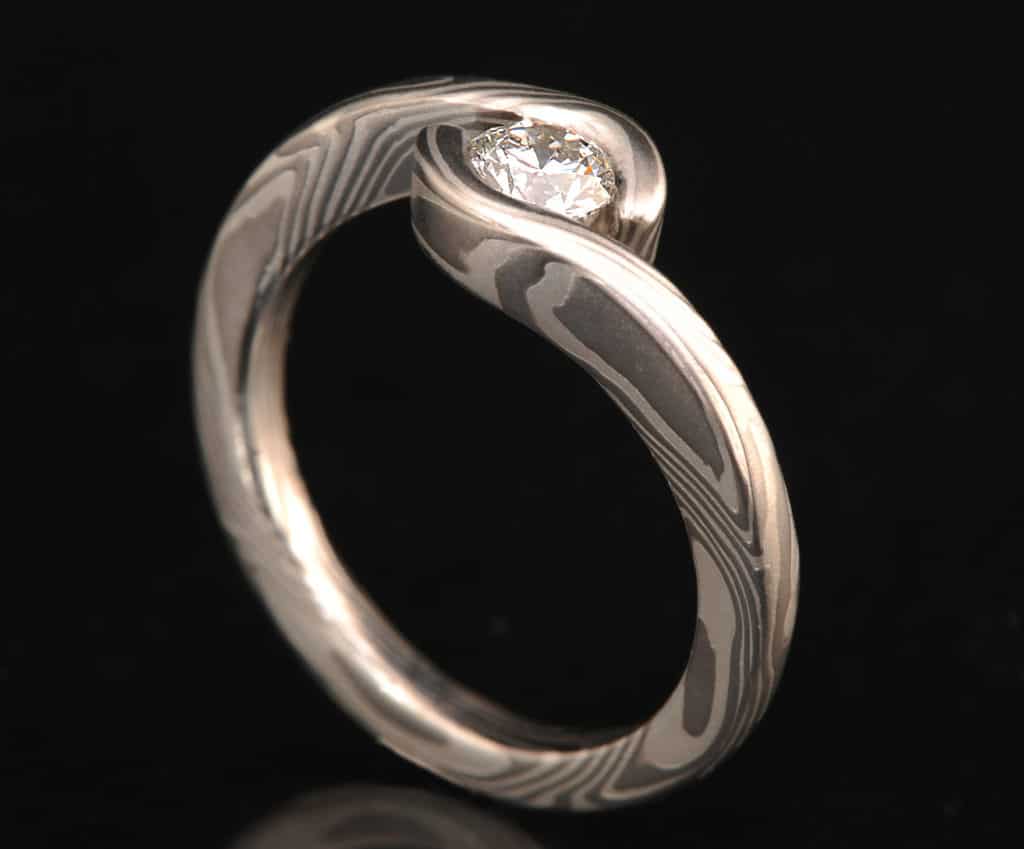 DIAMOND ENGAGEMENT RING with WRAP-AROUND SETTING 