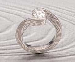 DIAMOND ENGAGEMENT RING with WRAP-AROUND SETTING 