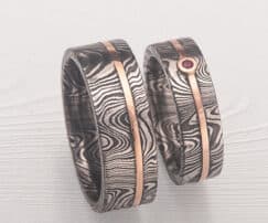 set of Damascus Stainless Steel rings with red gold